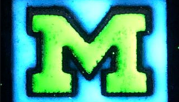 Block M logo shown at a microscopic scale